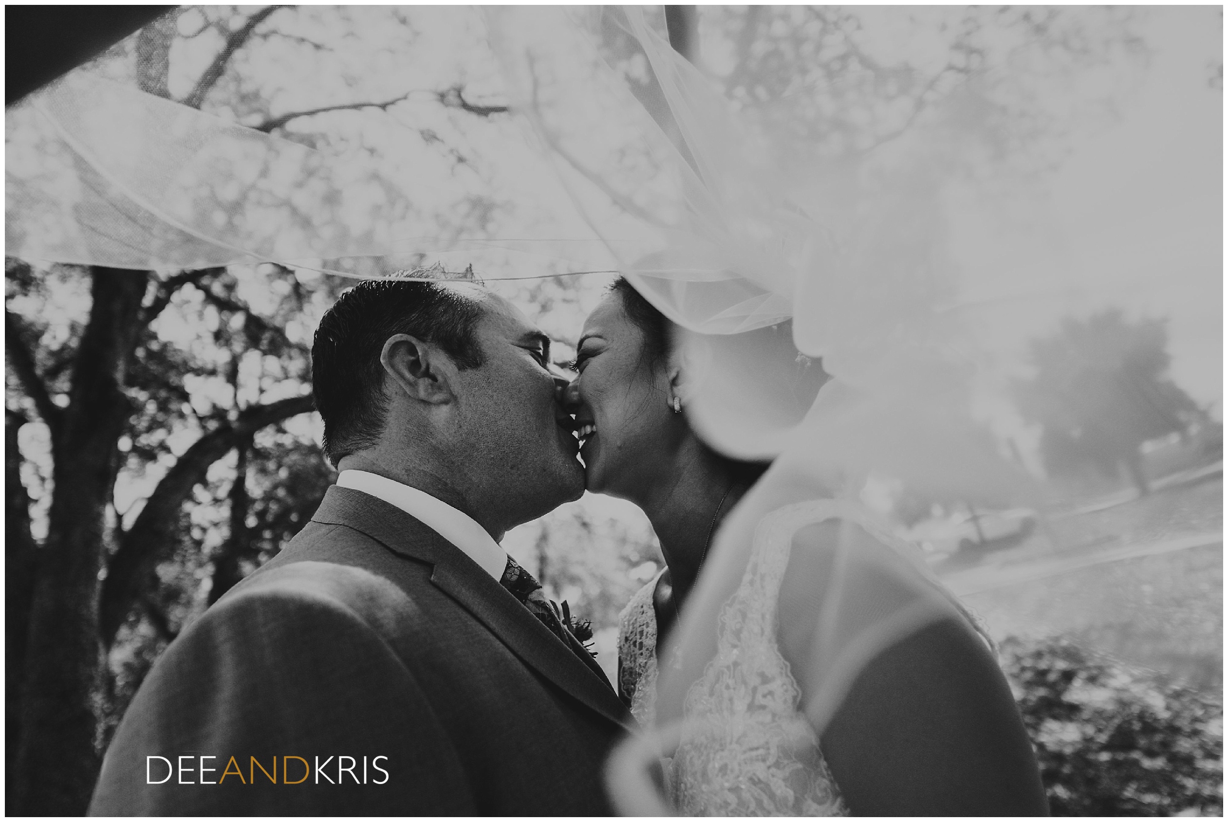 Sacramento wedding photographer photographs Bride and Groom at Catta Verdera, Black and White Wedding Photography, Under the veil kiss