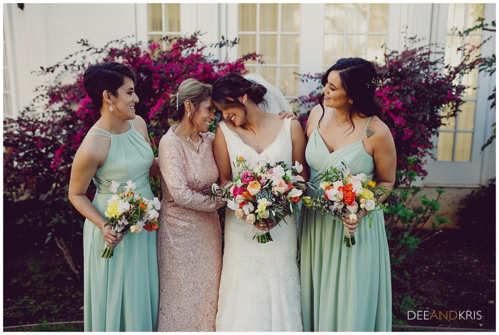 Bride with her sisters and mother on her wedding day 