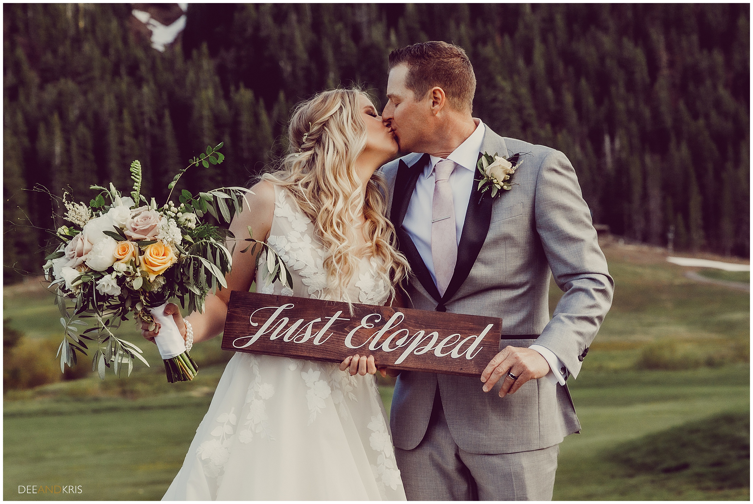 Bride and Groom hold Just Eloped Sign in Squaw Valley. 