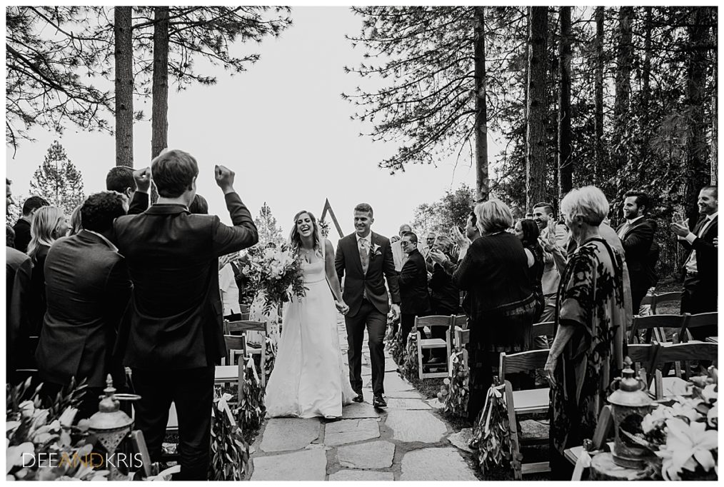 One black and white image of Bride and Groom's recessional.