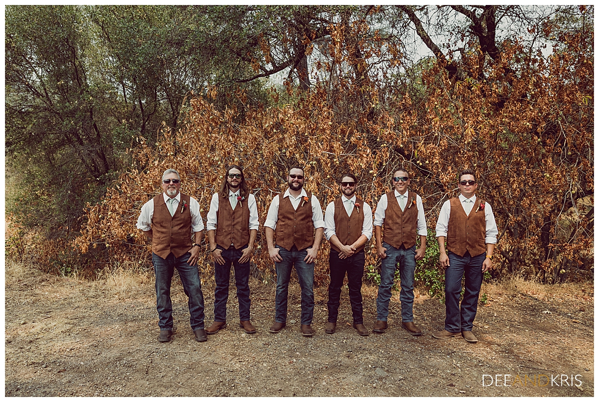 One image of the groom and his groomsmen lined up together in sunglasses.