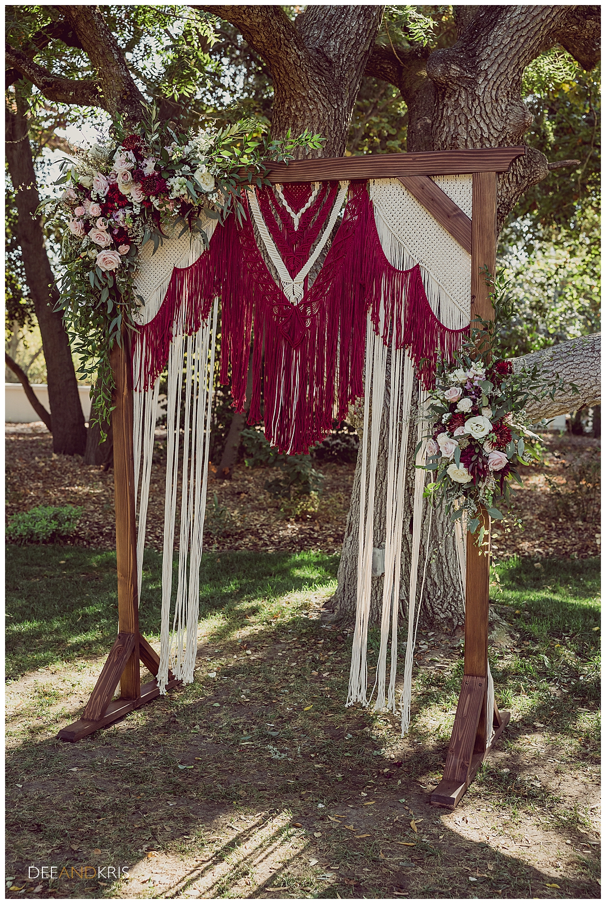 One image of the wooden archway draped in the crocheted fringe made by the bride.