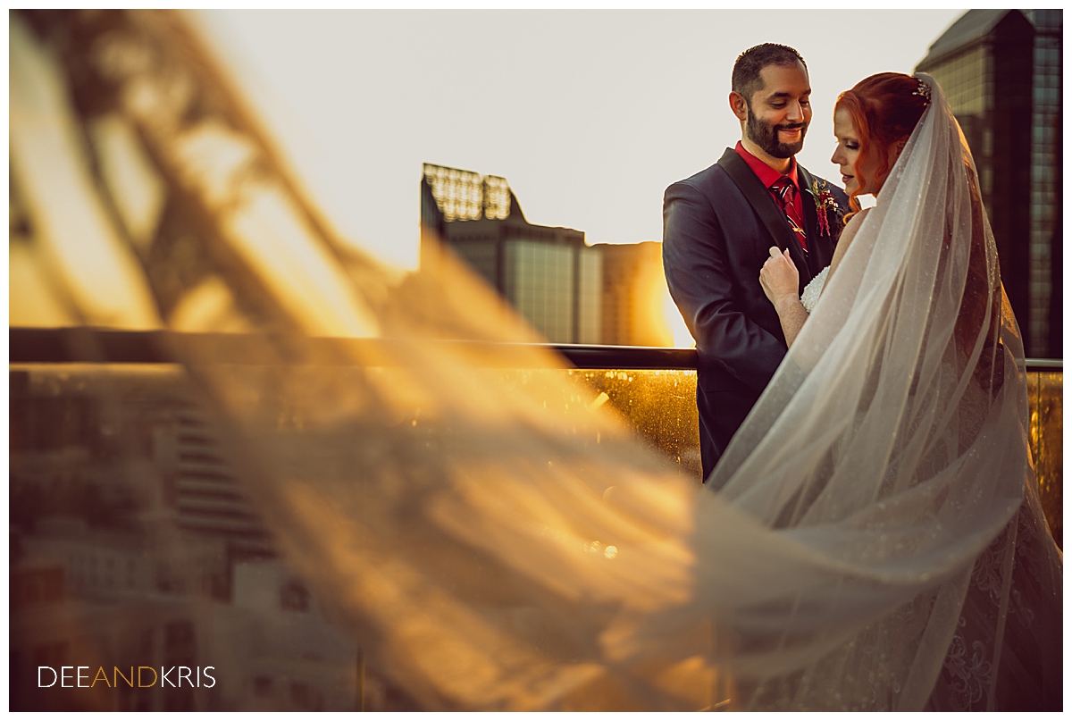 Bride and Groom atop the Citizen Hotel with cityscape as backdrop.