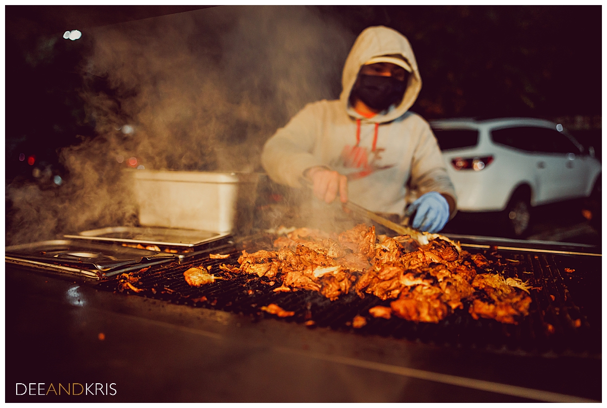 Single image of Chando's Tacos vendor making food for reception.