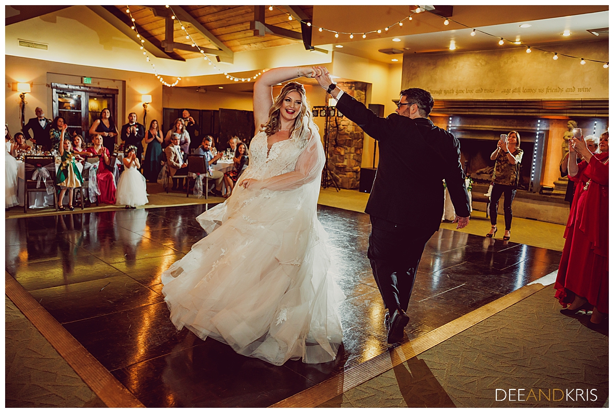 Single image of bride and groom dancing.